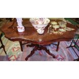 A Good Continental Walnut and Inlaid Centre Table, the profusely inlaid shaped top on a highly