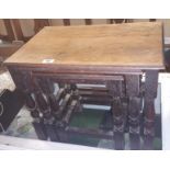 A Nest of Three Oak Tables; with a leather topped example.