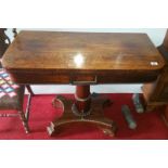 A Wonderful Mid 19th Century Rosewood Fold Over Card Table, having a turned centre column on a