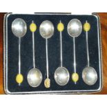 A Set of Six Silver Coffee Bean Spoons, in a case.