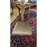 An Early 20th Century Walnut Queen Anne Style Side Chair; with an upholstered seat, carved crest