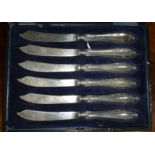 A Good set of Silver Handled Butter Knives.