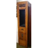 A Modern Oriental Court Cupboard; with fretwork design above a display with doors and a drawer.