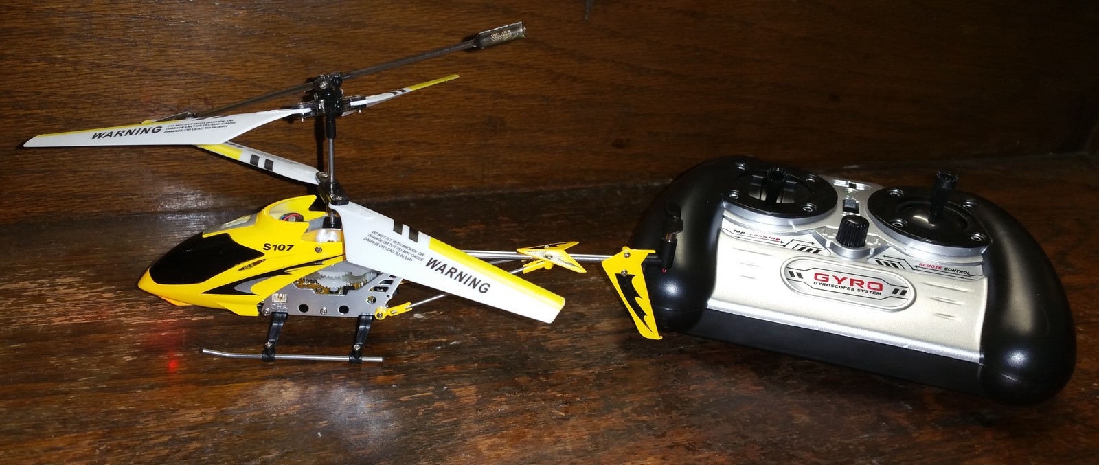 A Boxed Three Channel Radio Infrared Controlled Helicopter Gyroscope System S107G.(working order).