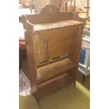 An Arts and Crafts Student Desk; with drop down desk slope and compartments with copper detail.