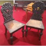 A Pair of 19th Century Oak Highly Carved Hall Chairs, Circa 1840.