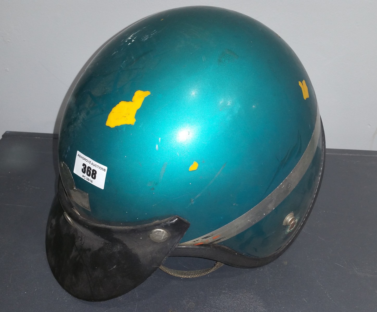 A Vintage Open Faced Motorcycle Helmet.