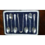 A Set of Six Silver Coffee Spoons and Matching Sugar Tongs.