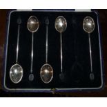 A Cased Set of Six Silver Bean and Coffee Spoons.