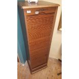 A Modern Oak Veneered Tambour Filing Cabinet, 150cm high, 45cm wide, 46cm deep. (key(s) in office).