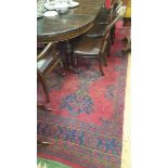 A Turkey Wool Carpet with Red Ground Field; with typical geometric decoration in a blue and green