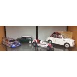 A Limited Edition Model of a Mini along with a Mini Cooper, a Mercedes and a Vintage Racing Car.