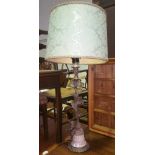 A 19th Century Metal & Marble Table Lamp with foliate support with seated cherub, with shade.