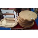 PROPS: A QUANTITY OF CIRCULAR PLACE MATS & GOLD COLOURED SERVING TRAYS.