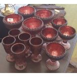 TWO SETS OF FOUR PURPLE SLAG GLASS PEDESTAL DISHES OF DIFFERENT SIZES & FIVE GOBLETS.