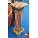 A PAIR OF PINK MARBLE PEDESTALS HAVING A SQUARED TAPERED COLUMN WITH CAST BRASS DECORATION.