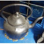 AN 18TH CENTURY CAST IRON KETTLE ON A BRASS TRIVET. (Sir Malcolm's Kitchen).