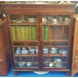 A 19TH CENTURY MAHOGANY TWO DOOR DISPLAY CABINET with inlaid doors.