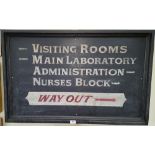 A 'VISITING ROOMS' ADVERTISING SIGN.