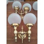 A LOVELY PAIR OF ADJUSTABLE TWIN BRANCH BRASS WALL LIGHTS with glass dome shades.