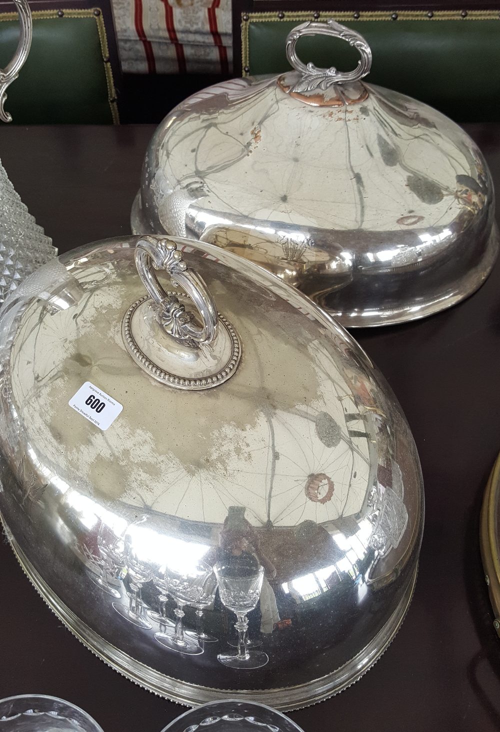 TWO LARGE 19TH CENTURY SILVER-PLATES MEAT DOMES, ONE CRESTED.