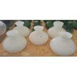 A GROUP OF FIVE WHITE GLASS SHADES.