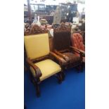 AN IMPRESSIVE PAIR OF UPHOLSTERED THRONE CHAIRS with highly carved backs, arms and front legs.