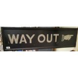 A 'WAY OUT' SIGN.