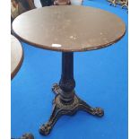 A SMALL CIRCULAR BAR TABLE with heavy decoration and cast iron tripod base. (Used in Limehouse