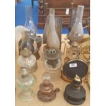 A COLLECTION OF VARIOUS OIL LAMPS.