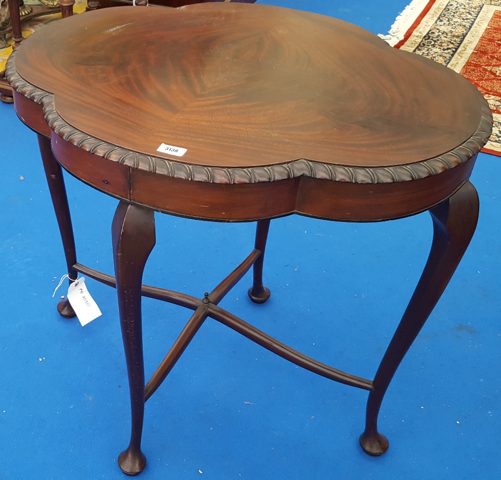 AN EARLY 20TH CENTURY SHAPED SIDE TABLE.
