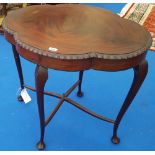 AN EARLY 20TH CENTURY SHAPED SIDE TABLE.