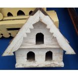 A TIMBER BUILT BIRD HOUSE.