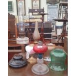 A QUANTITY OF VARIOUS OIL LAMPS AND SHADES.
