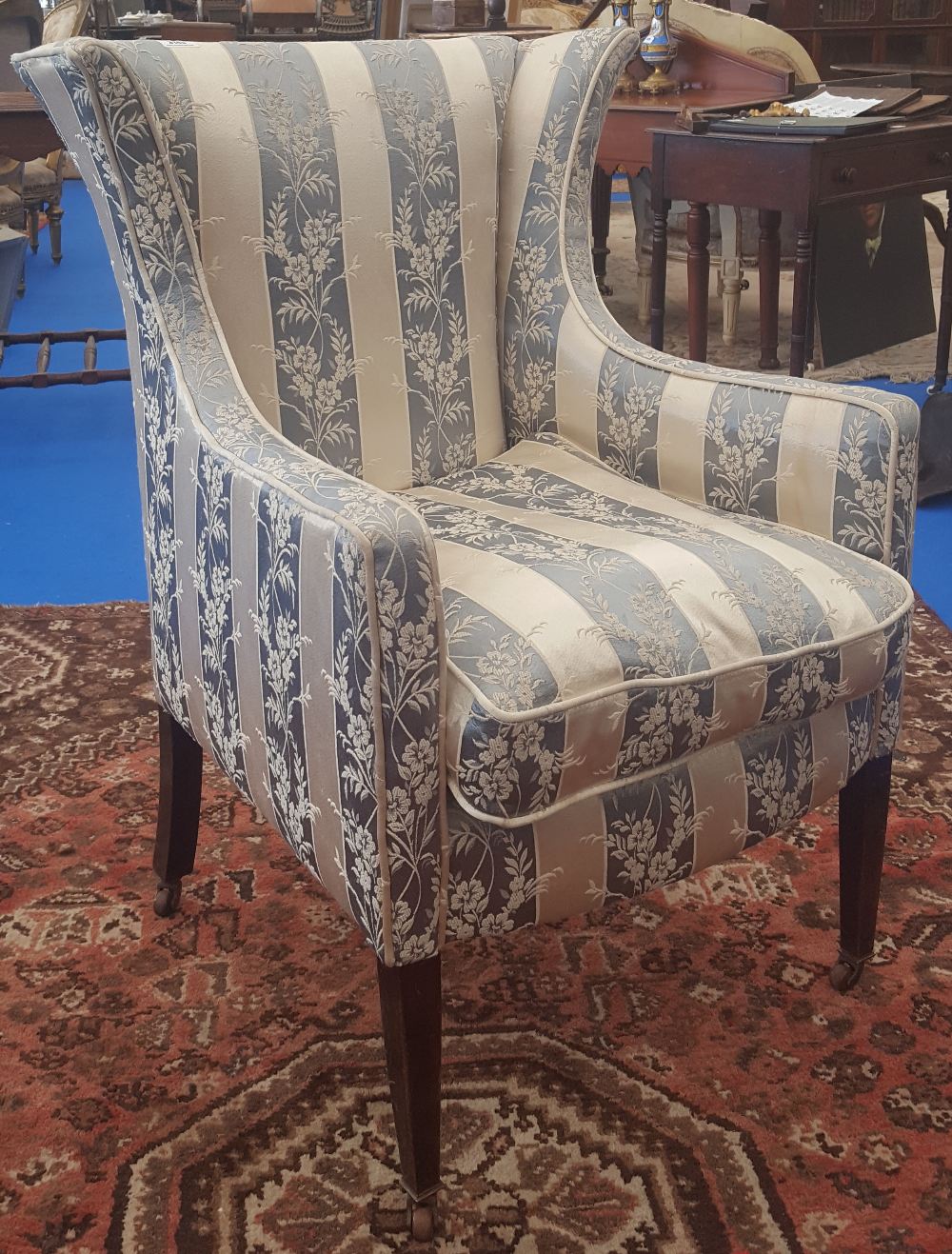 A GOOD LATE 19TH CENTURY MAHOGANY UPHOLSTERED WING BACK CHAIR.