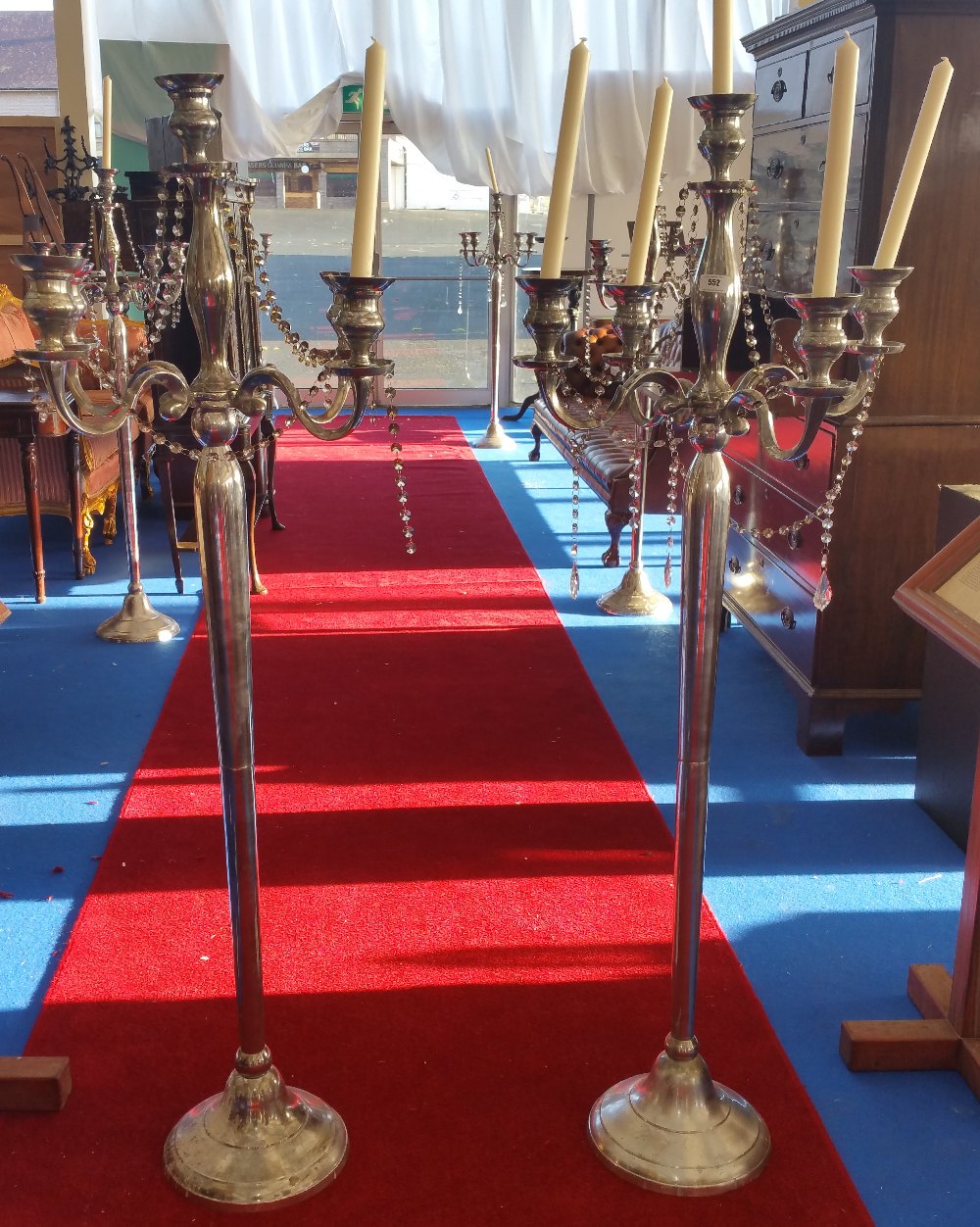 A LARGE PAIR OF FOUR BRANCH CANDLESTICKS. (Dorian's Portrait Room).