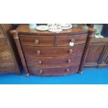 A MID TO LATE 19TH CENTURY MAHOGANY BOW FRONT CHEST OF DRAWERS with two short over three long with