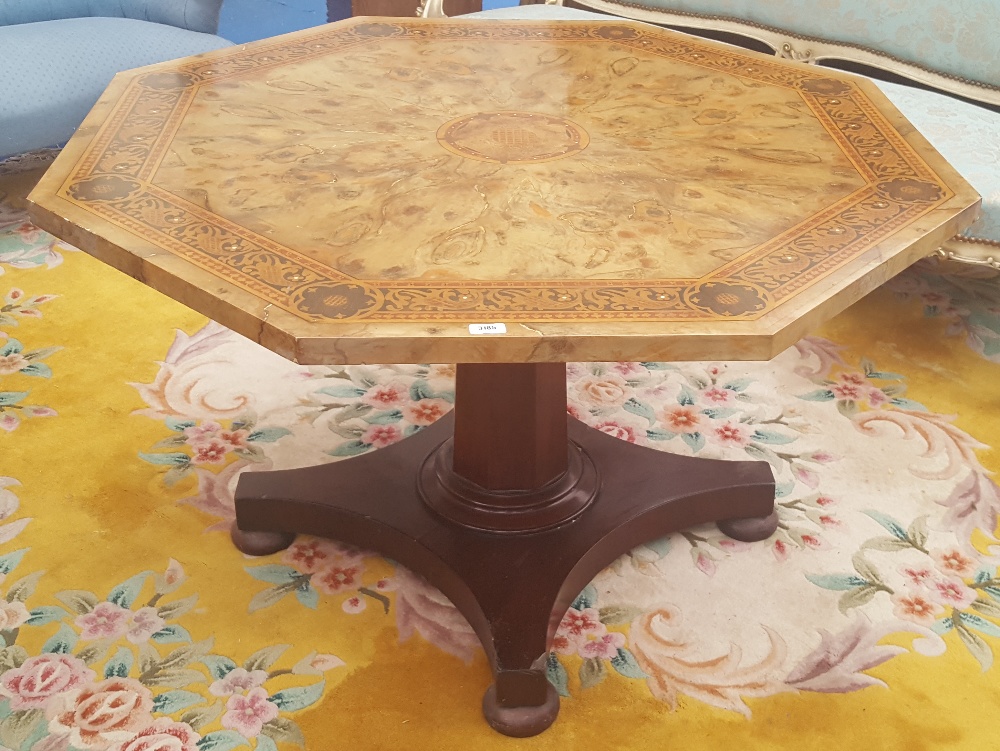 A MAHOGANY BASED FAUX MARBLE TOPPED OCTAGONAL CENTRE TABLE early 19th century and later.