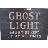 'GHOST LIGHT MUST BE KEPT LIT AT ALL TIMES' SIGN.