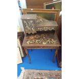 A VERY UNUSUAL HARDWOOD SIDE TABLE with a raised drawer and door above a carved top with a frieze