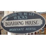 A 'BOWLING HOUSE' SIGN.