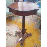 A CONTINENTAL WALNUT AND MAHOGANY UNUSUAL SHAPED SIDE TABLE with ormolu mounts.