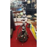 A BLACK AND CLEAR GLASS HOOKAH. (Dorian's Portrait room)(chip to top).