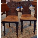 A PAIR OF WILLIAM IV MAHOGANY HALL CHAIRS.