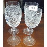 A GOOD SET OF FOUR WATERFORD CRYSTAL RED WINE GLASSES.