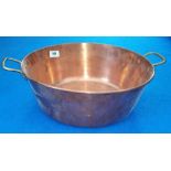 A COPPER JAM PAN WITH BRASS HANDLES (Sir Malcolm's Kitchen).