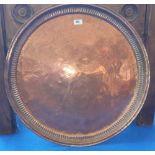 A 19TH CENTURY COPPER TRAY of large proportions. 25.5in diameter (Sir Malcolm's Kitchen).