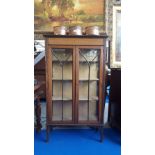 AN EARLY 20TH CENTURY DISPLAY CABINET OF NEAT PROPORTIONS with boxwood stringing and hand painted