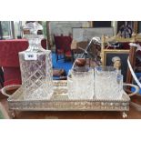 A CRYSTAL WHISKEY DECANTER along with a set of four crystal whiskey glasses on a silver plated tray.