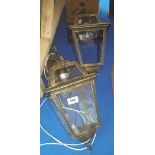 A PAIR OF METAL & GLASS HALL LANTERNS.